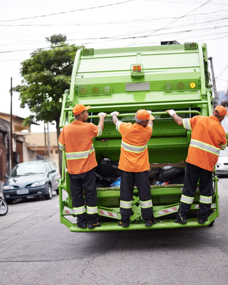 Garbage collection day. Cropped shot of a garbage collection team at work